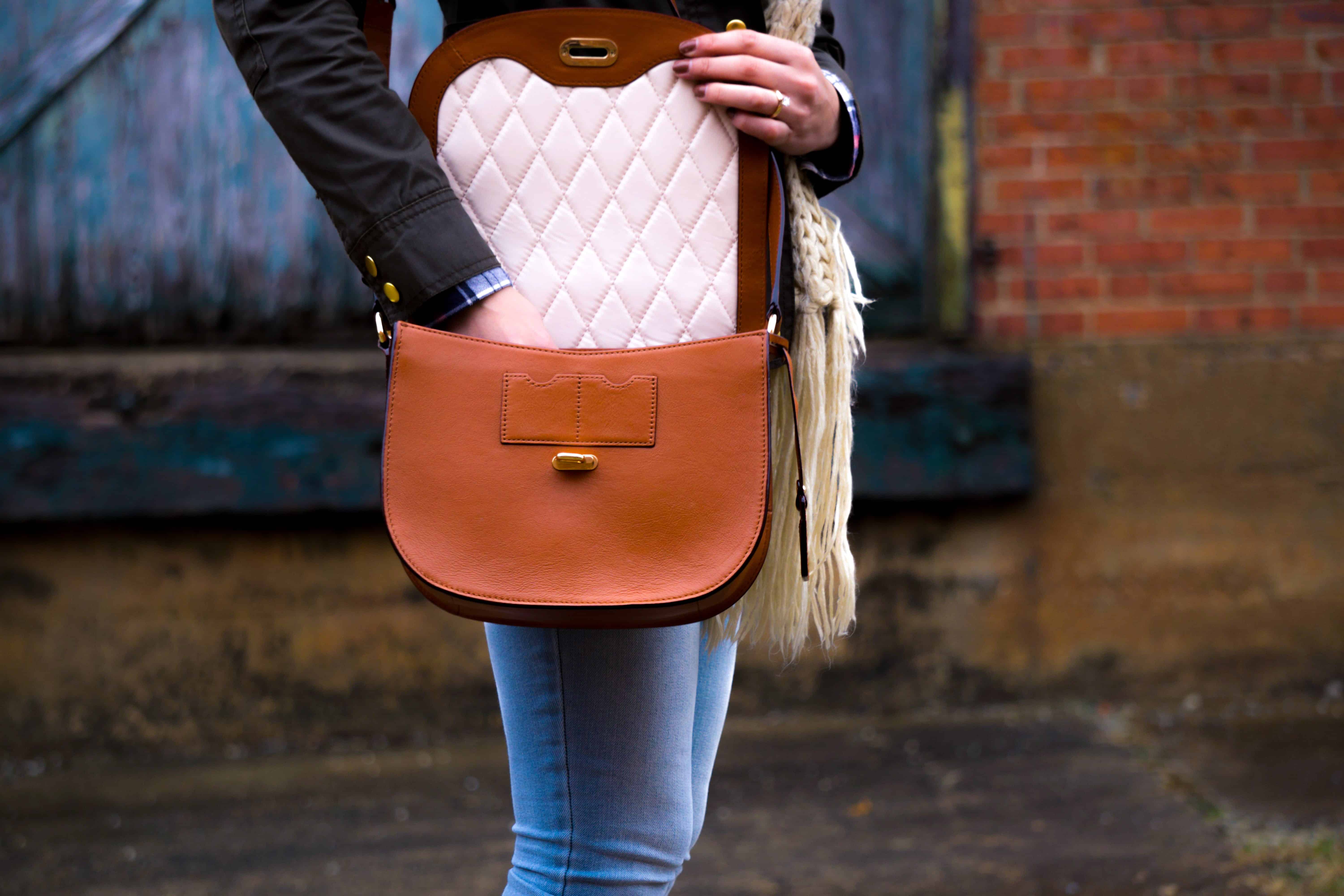 A lady holding a leather bag